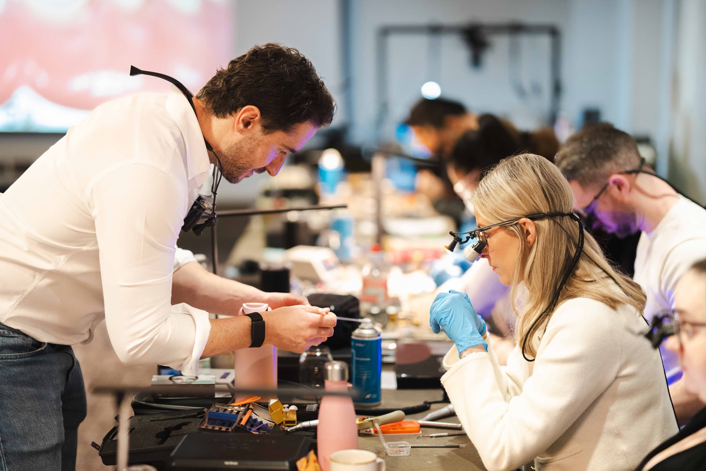 Dr Albert Gajdos helping a delegate at the bench on the Simplifi Composite course