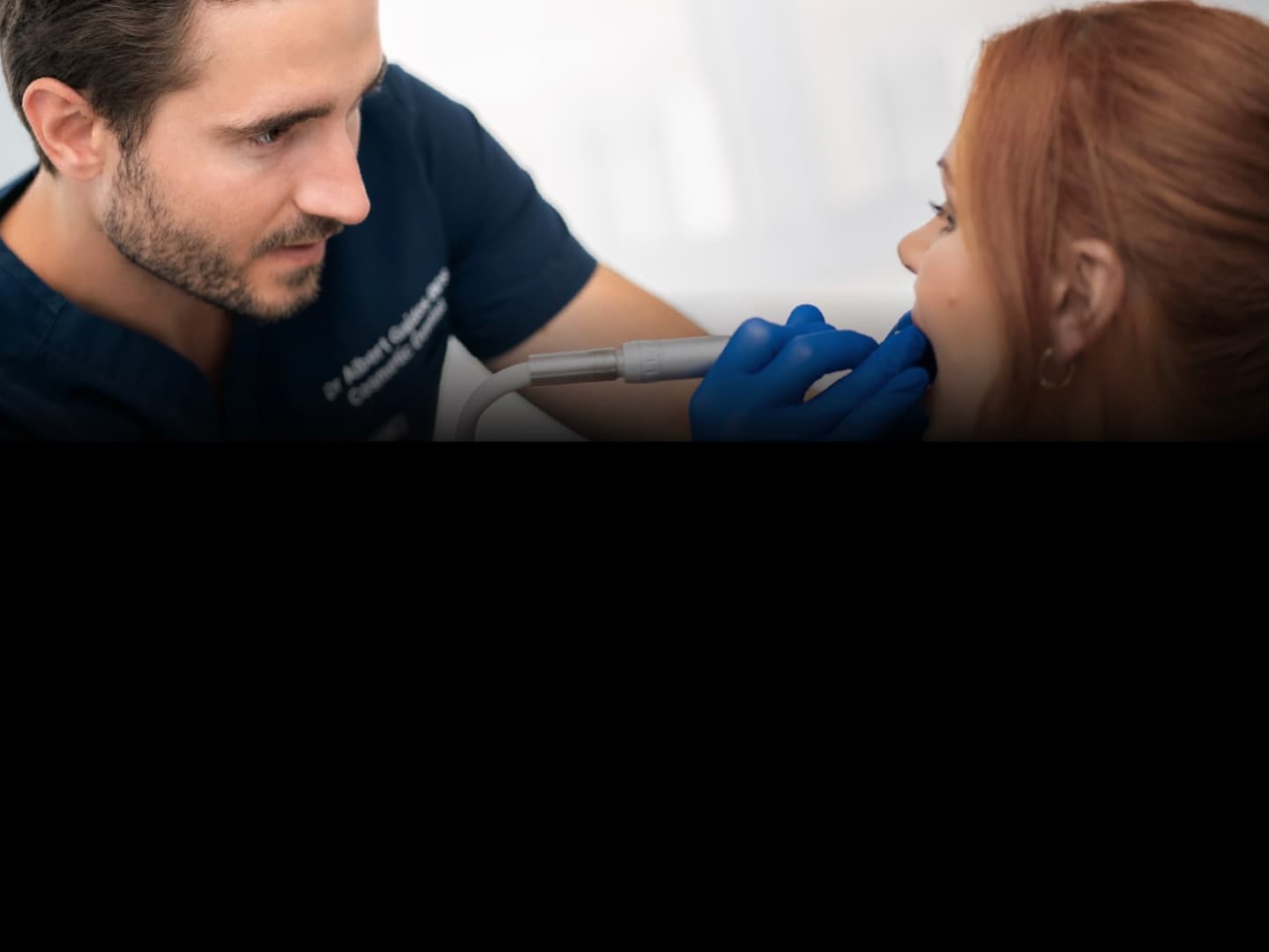 Dr Albert Gajdos treating a patient in surgery, the day you shadow on Simplifi Live